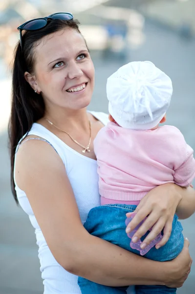 Young mother holds the baby on arms — Stock Photo, Image