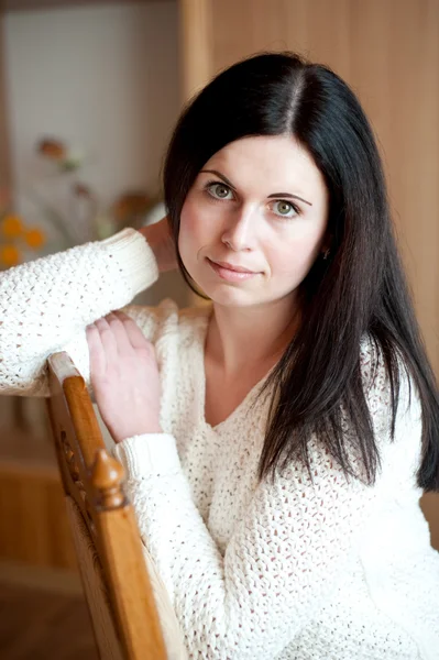 The sensual girl on a chair — Stock Photo, Image