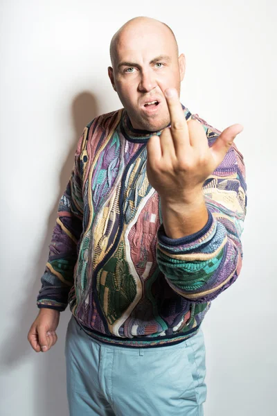 Image of a displeased man showing middle finger. Isolated on whi — Stock Photo, Image