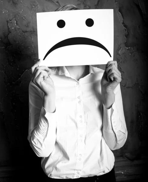 Holding a blank paper with sad face — Stock Photo, Image