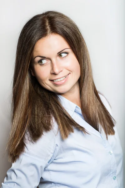 Beautiful young woman smiling on white background — Stock Photo, Image