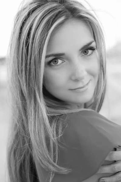 Beautiful young girl, red dress, looks in the camera — Stock Photo, Image