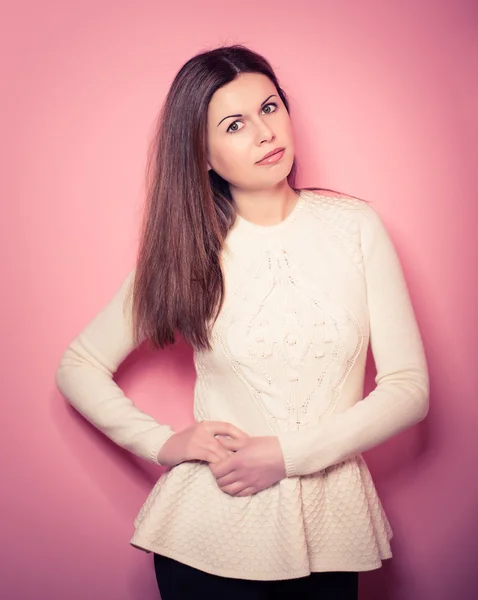 beautiful, young woman poses in studio