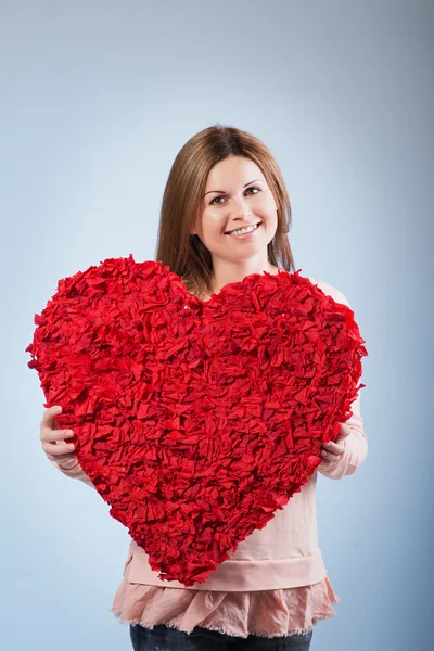 Beautiful happy woman hold Valentine day symbol — Stock Photo, Image