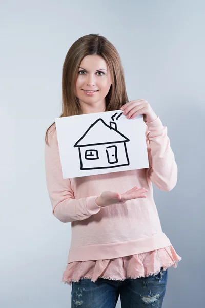 Žena hospodářství obrázek s domem — Stock fotografie
