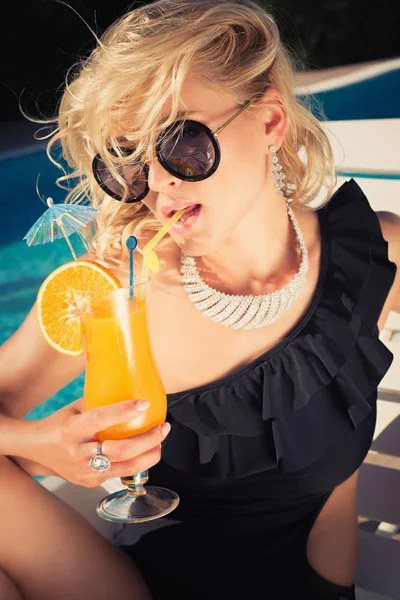 Young sexy woman drinking cocktail — Stock Photo, Image