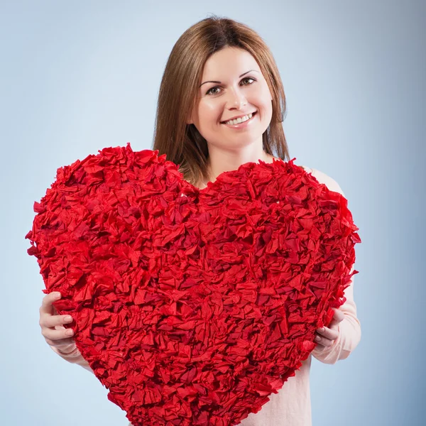 Beautiful happy woman hold Valentine day symbol — Stock Photo, Image