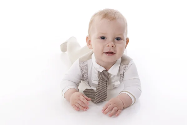 Sonriente bebé-niño en un traje de mameluco arrastrándose —  Fotos de Stock