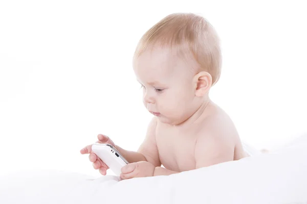 Sourire bébé apprend à faire face à un téléphone — Photo