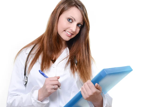 Uczeń bardzo kobiece kobieta lekarz pisanie notatek — Zdjęcie stockowe
