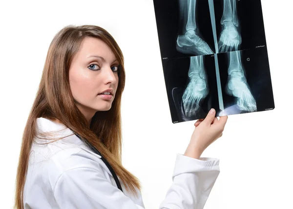 Female doctor looking at X-ray image — Stock Photo, Image