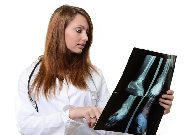 Female doctor looking at X-ray image — Stock Photo, Image