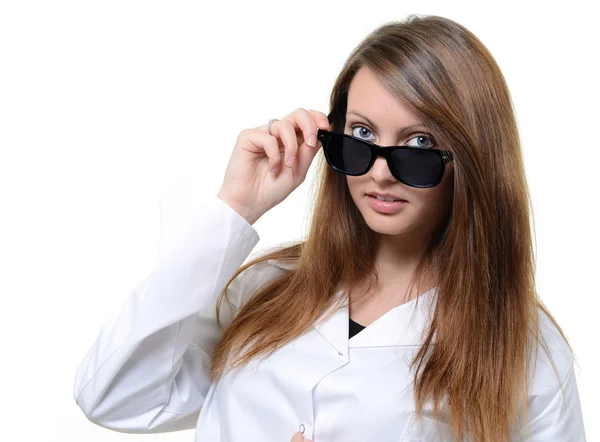 Pretty doctor portrait with glasses in her hand — Stock Photo, Image