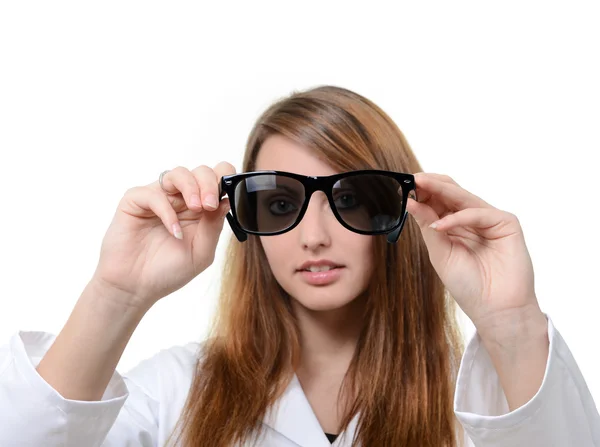 Pretty doctor portrait with glasses in her hand — Stock Photo, Image