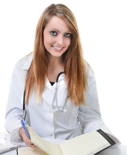 Uczeń kobiece kobieta lekarz pisania w terminarz — Zdjęcie stockowe