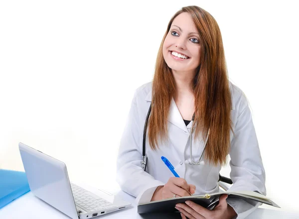 Estudiante doctora escribiendo en un Planificador Fotos de stock