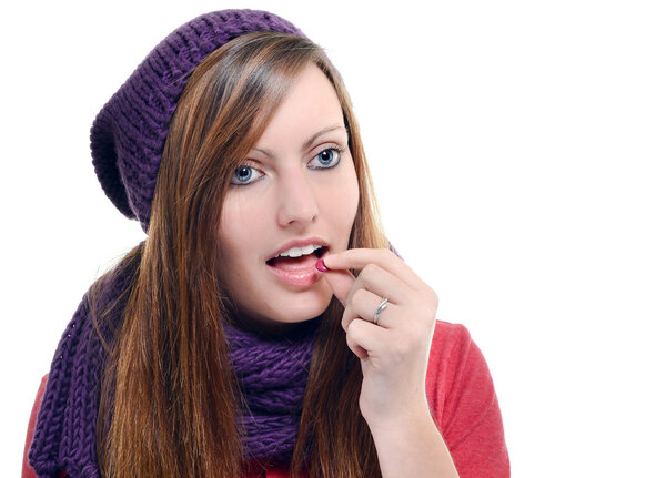 beautiful female taking tablet against a white background