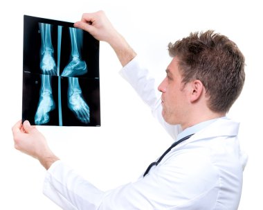 attractive and expressive doctor holding x-ray clipart