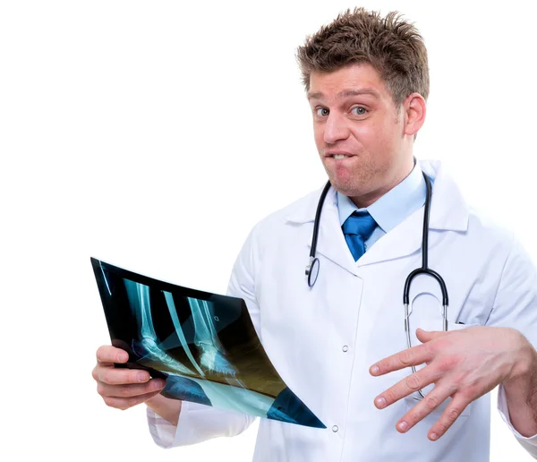 Expressive doctor examining broken foot x-ray — Stock Photo, Image