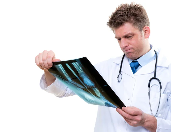 Attractive male doctor examining foot x-ray — Stock Photo, Image