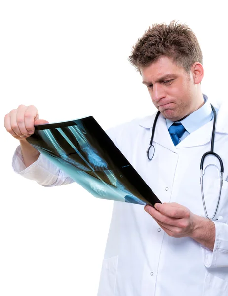 Attractive male doctor examining foot x-ray — Stock Photo, Image