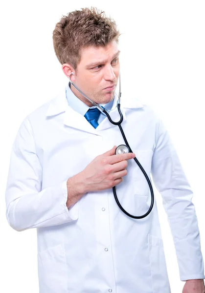 Cherfull male medical doctor listening with a stethoscope — Stock Photo, Image