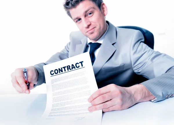 Handsome business man invites to sign a business contract — Stock Photo, Image