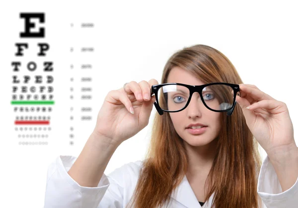 Pretty doctor portrait with glasses in her hand — Stock Photo, Image