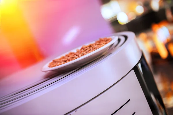 Closeup of an pellet stove with wood pellets on top — Stock Photo, Image
