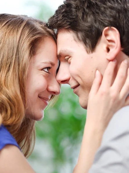 Attractive couple of lovers look at each other with love — Stock Photo, Image