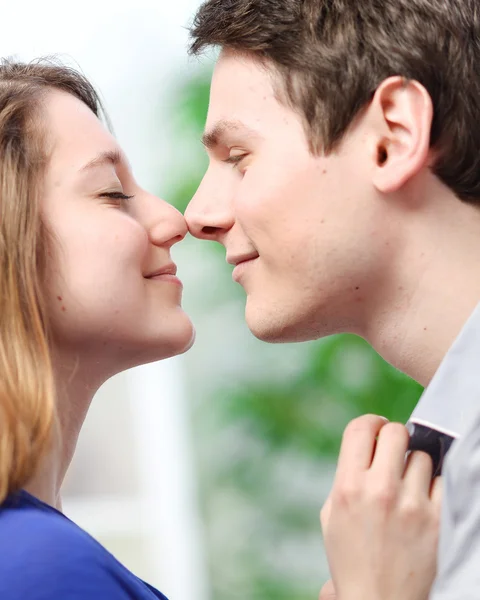 Attractive couple of lovers look at each other with love — Stock Photo, Image