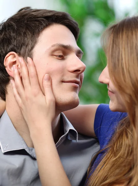 Pretty woman stroking the cheek of her boyfriend with love — Stock Photo, Image