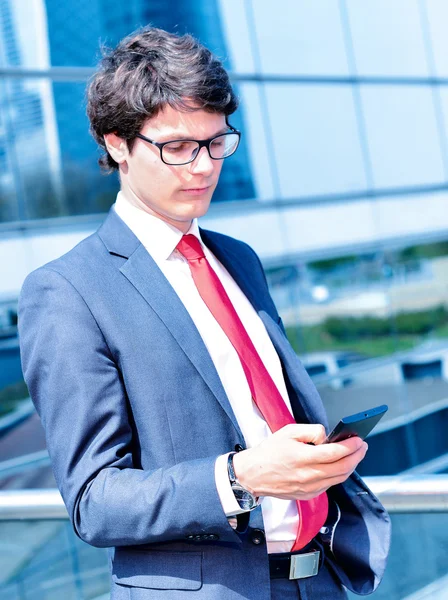 Junior executive dynamic phoning outside of his office — Stock Photo, Image