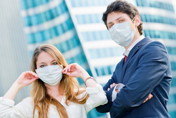 Junior executives dynamics  wearing protective face mask against