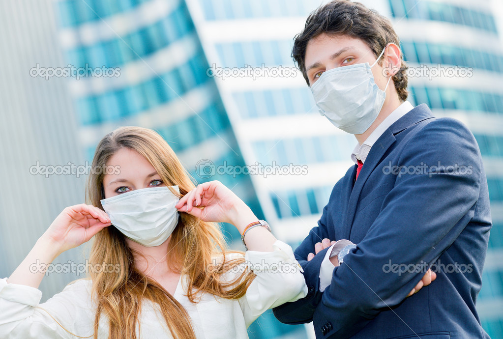 Junior executives dynamics  wearing protective face mask against