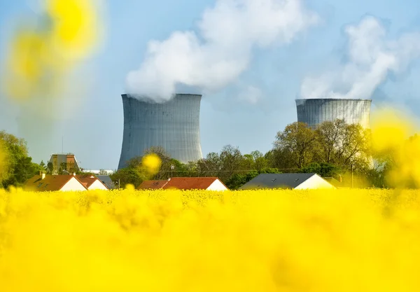 Nuclear power plant and colza fields Stock Photo