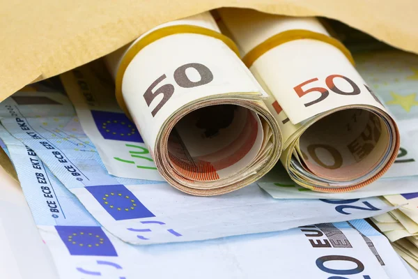 Envelope full of euro cash — Stock Photo, Image