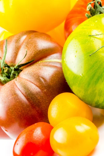 Many varieties of colorful tomatos — Stock Photo, Image