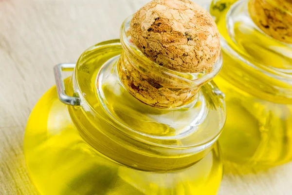 Bottle of olive oil with cherry tomatoes — Stock Photo, Image