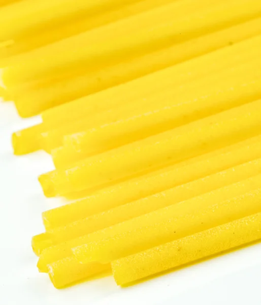 Uncooked Italian spaghetti on a white background — Stock Photo, Image
