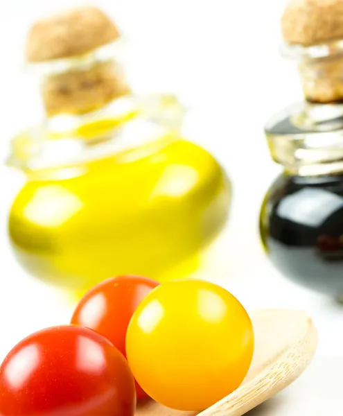 Colorful tomatos with olive oil and vinegar — Stock Photo, Image