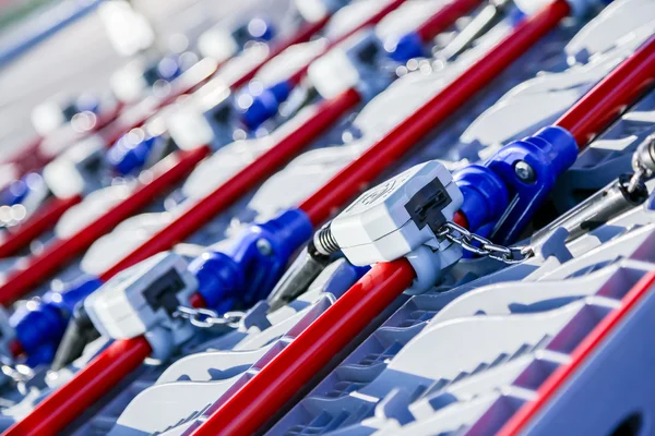 Row of shopping trolleys or carts in supermarket — Stock Photo, Image