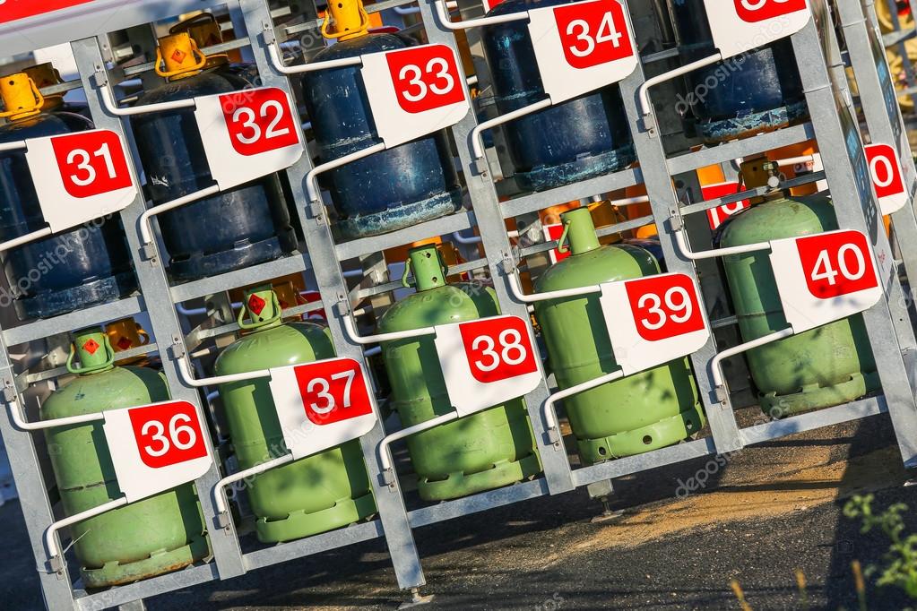 Stacks of gas cylinders on a distributor — Stock Photo © Pixinooo 51329365