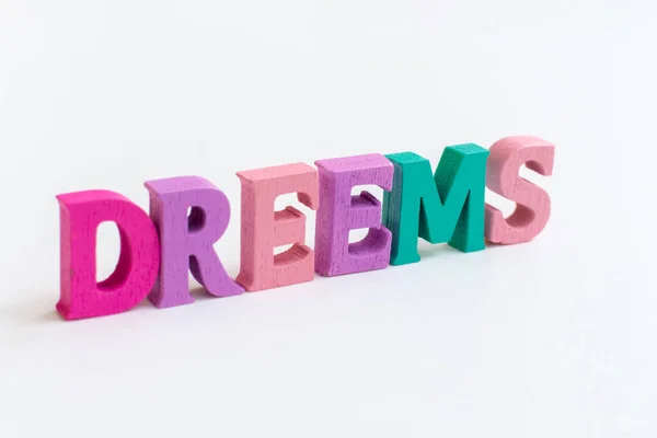 Dreams Inscription Multi Colored Letters White Background Beautiful Card Hand — Stok fotoğraf