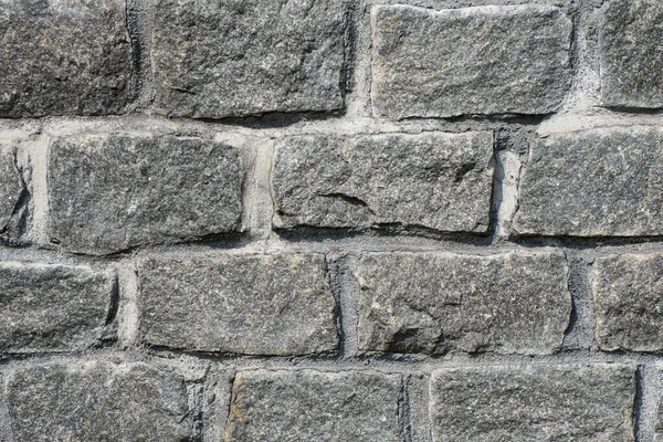 天然花岗岩石墙 粗糙的天然石头 石墙覆层纹理灰色石砖的背景 — 图库照片