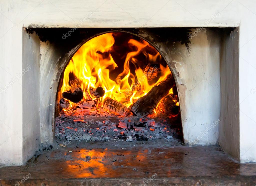 The fire in the old stove in the village