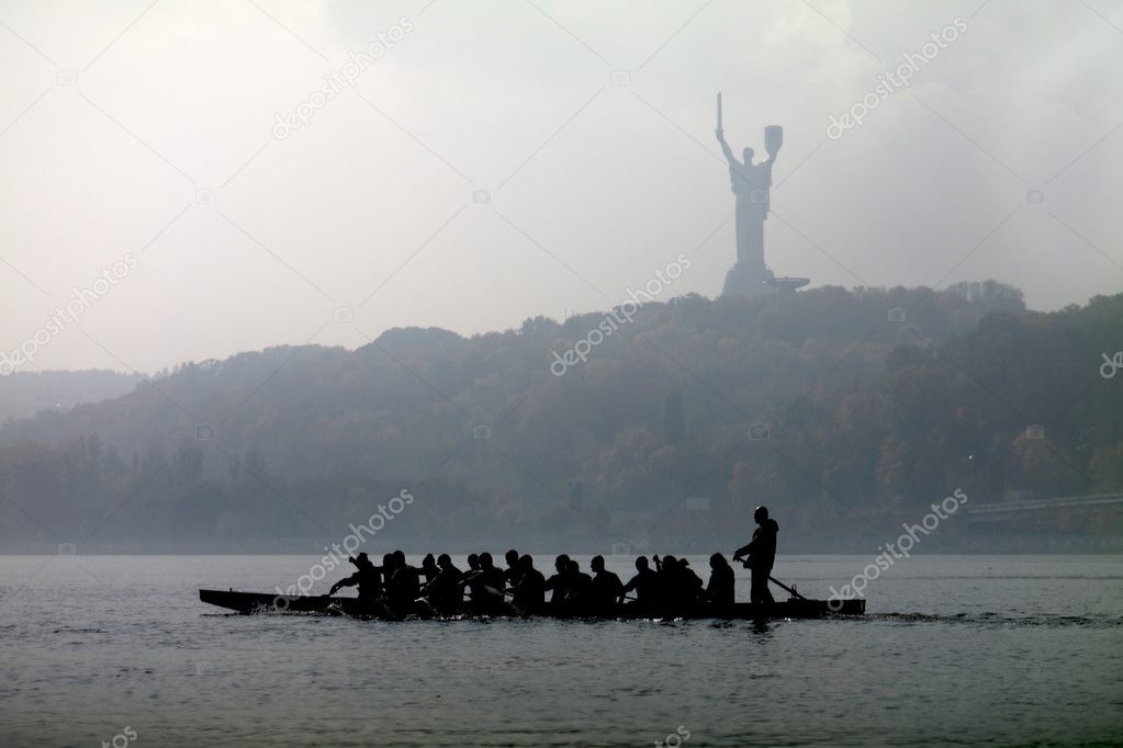 Silhouette of a sailing canoe
