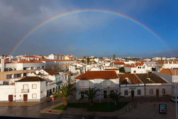 Rainbow over the city of Tavira — Stock Photo, Image