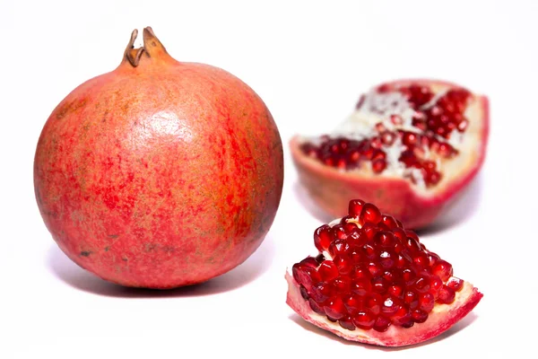 Pomegranate with slice — Stock Photo, Image