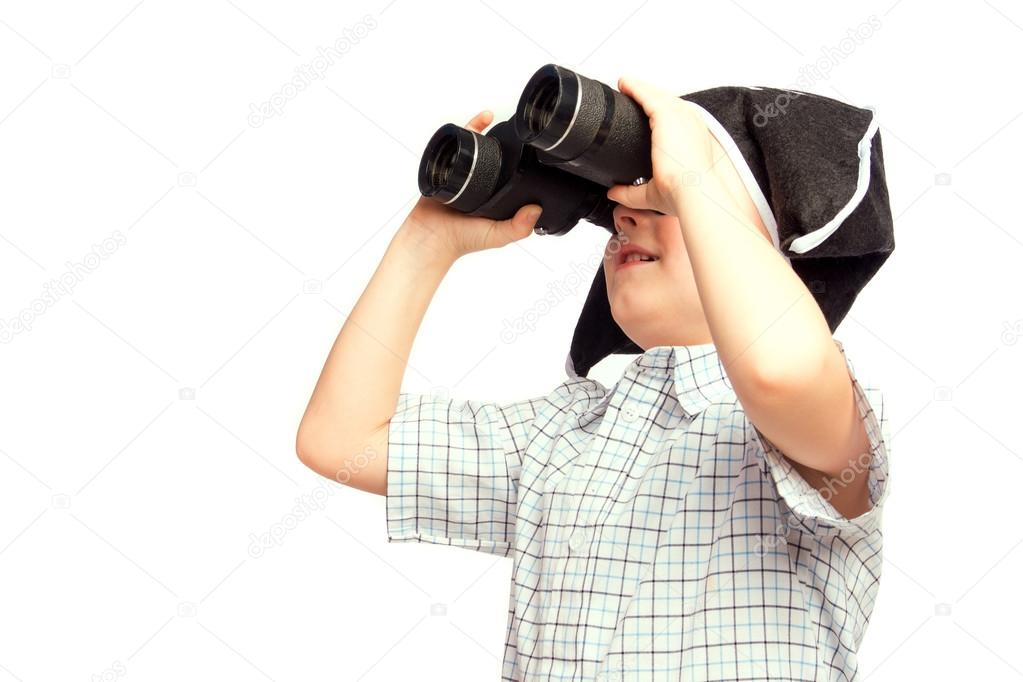 Child in pirate hat looking in binoculars